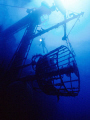 The  crow's nest  of the Cedar Pride wreck. Note the little diver in the center of photo with light. 